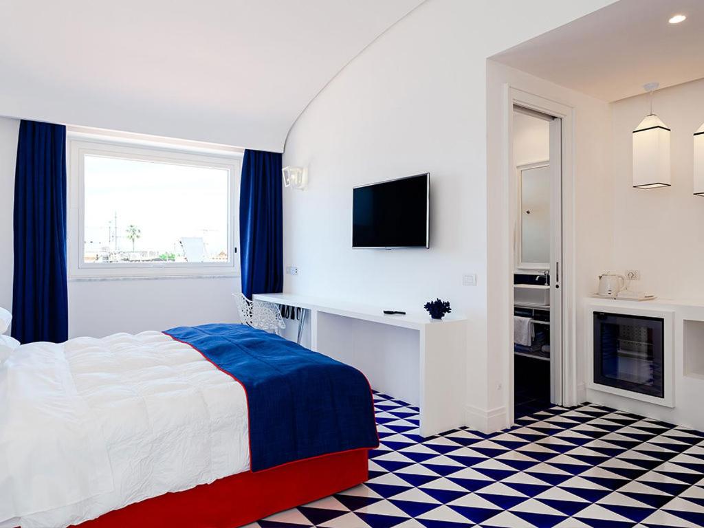 Postel nebo postele na pokoji v ubytování Maison Blu - Intimate GuestHouse