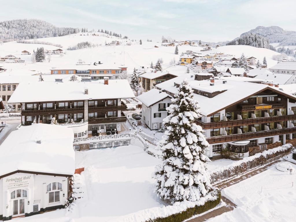 an aerial view of a resort in the snow at Genuss - und Vitalhotel Moisl in Abtenau