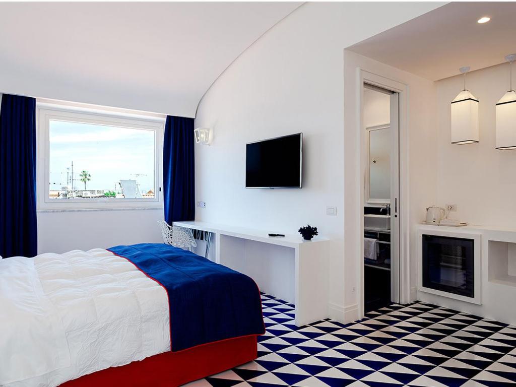 Postel nebo postele na pokoji v ubytování Maison Blu - Intimate GuestHouse