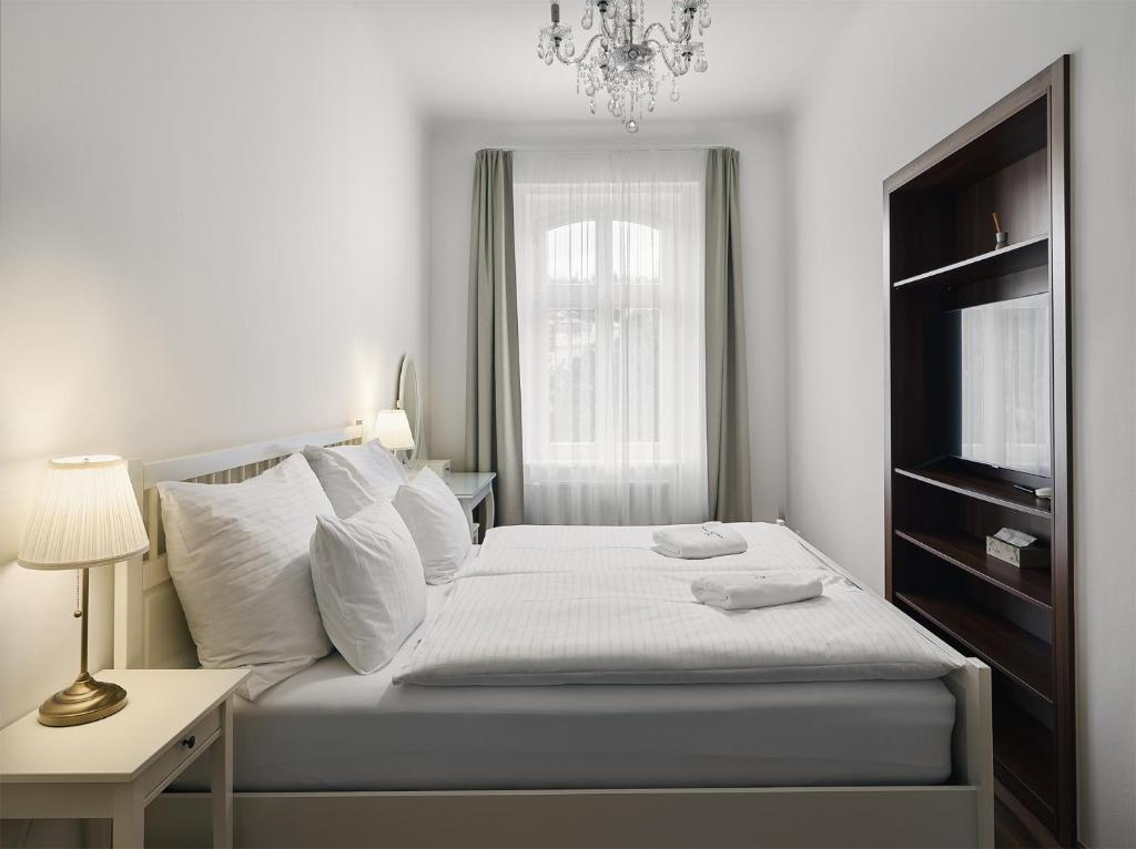 Postel nebo postele na pokoji v ubytování IMPERIAL Apartments