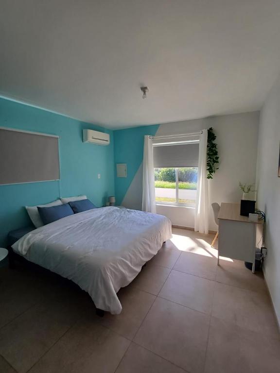 Postel nebo postele na pokoji v ubytování Coba Lodo Family house
