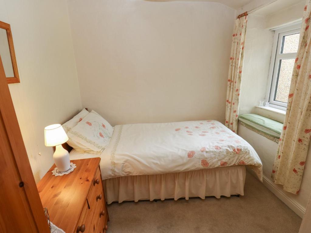 Postel nebo postele na pokoji v ubytování Marsh Cottage