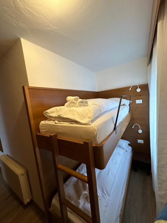 Postel nebo postele na pokoji v ubytování Hotel Ferrari