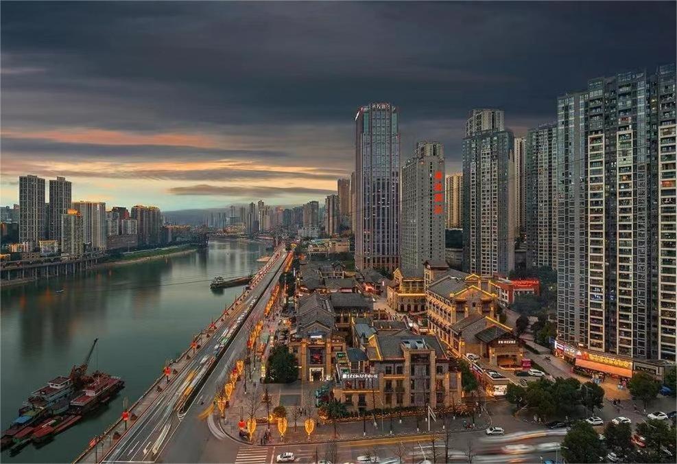 a view of a city with a river and buildings at Boutique of Meditation with Cuisine & Night View, Exit 2 Liujiatai Station Line 9 in Chongqing