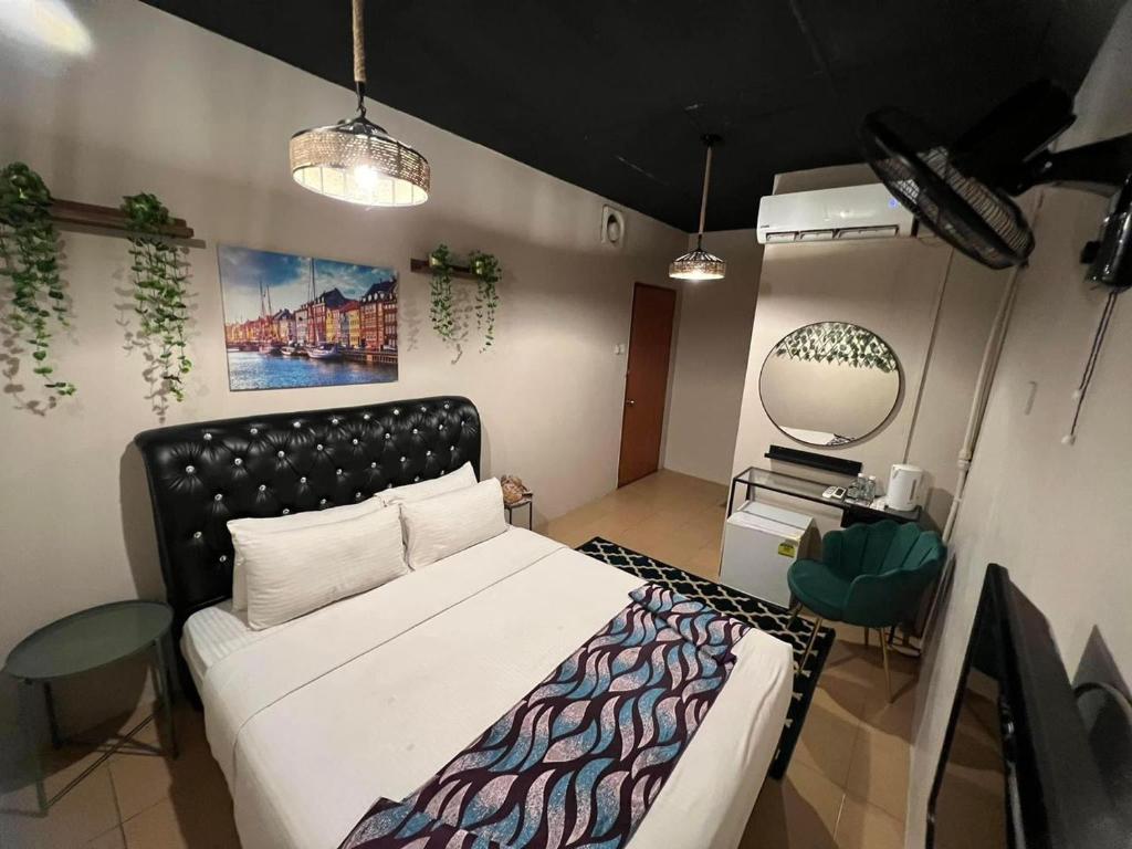Katil atau katil-katil dalam bilik di Ghazrins Garuda Hotel