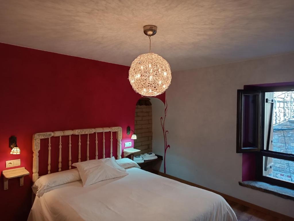 Postel nebo postele na pokoji v ubytování Mora de Nuei