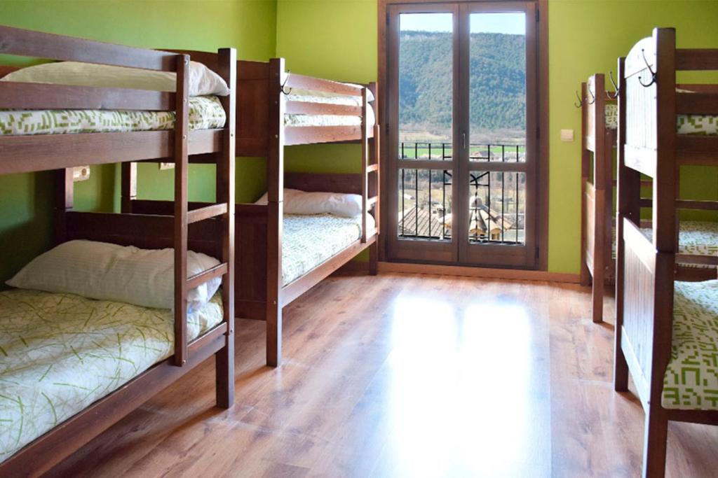 Postel nebo postele na pokoji v ubytování Mora de Nuei
