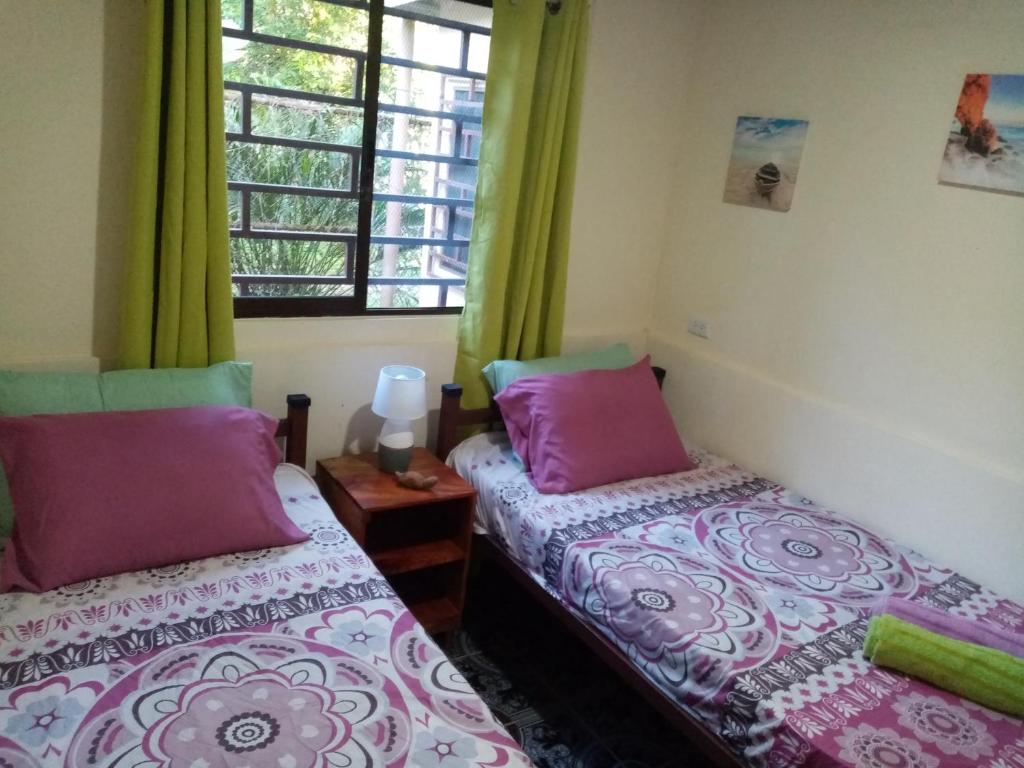 Postel nebo postele na pokoji v ubytování La Casita