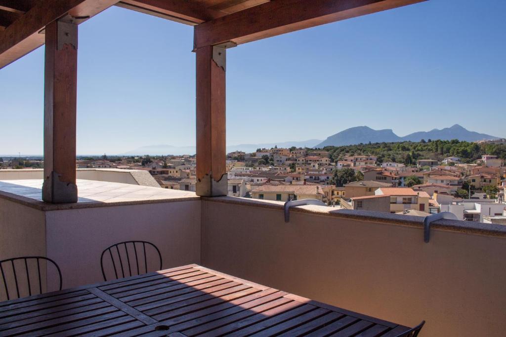 a balcony with a table and chairs and a view at Residenze Branca III SeaView in Orosei