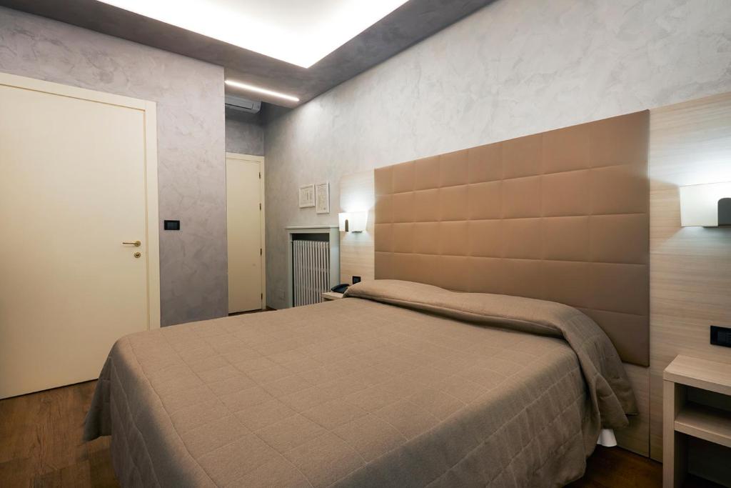 Postel nebo postele na pokoji v ubytování Hotel Galimberti