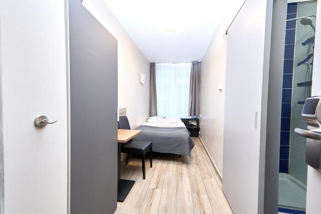 Postel nebo postele na pokoji v ubytování Hotel City Center