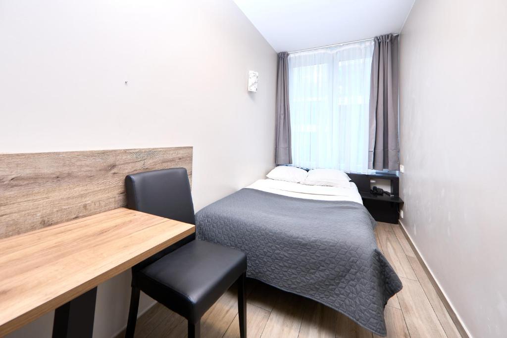 Postel nebo postele na pokoji v ubytování Hotel City Center