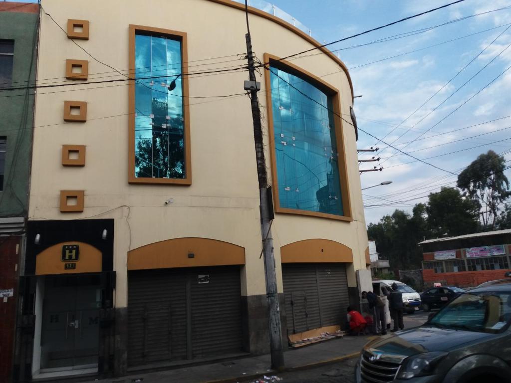 a building with large windows on the side of it at HOTEL MURCIA AREQUIPA in Arequipa