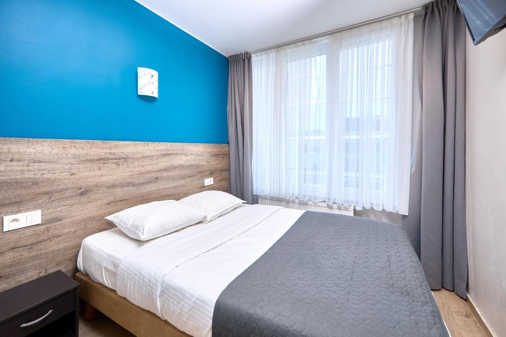 Postel nebo postele na pokoji v ubytování Hotel City Center