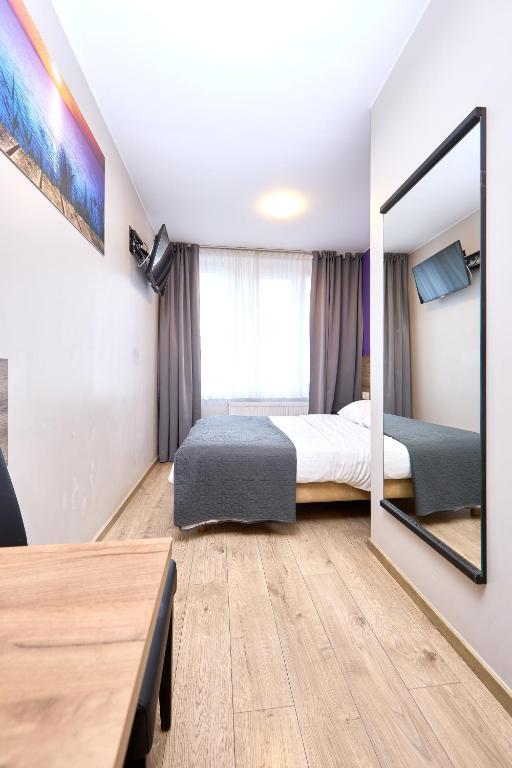 Postel nebo postele na pokoji v ubytování Hotel City Center