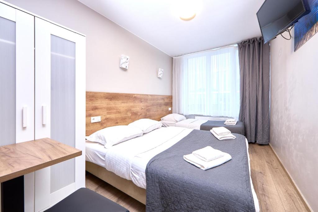 Postel nebo postele na pokoji v ubytování Hotel City Center