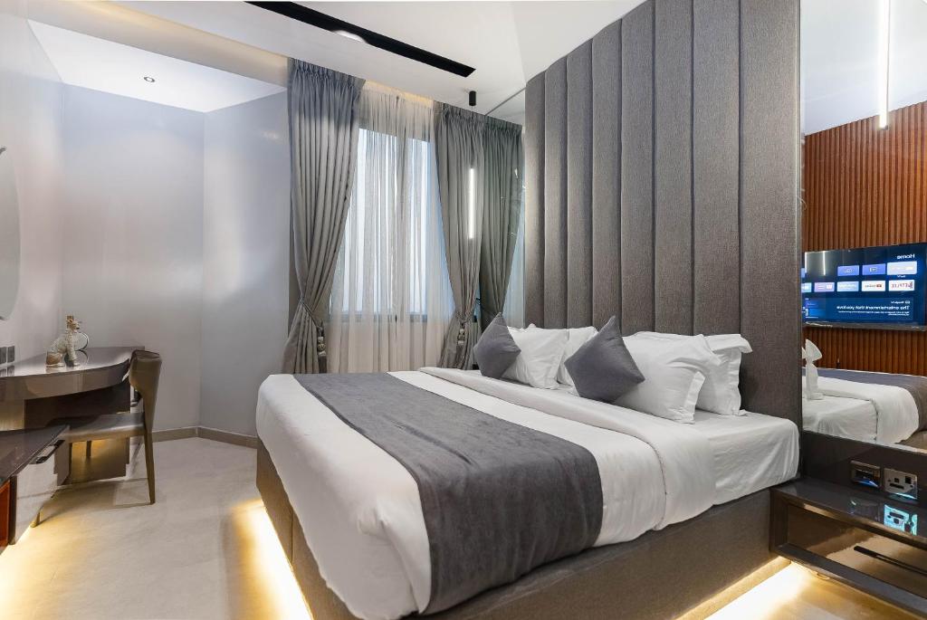 Postel nebo postele na pokoji v ubytování GTA HOTEL IKEJA