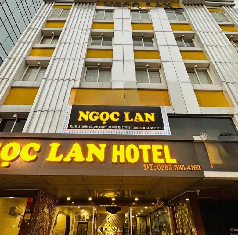 a msg lan hotel sign in front of a building at Ngọc Lan Hotel in Ho Chi Minh City