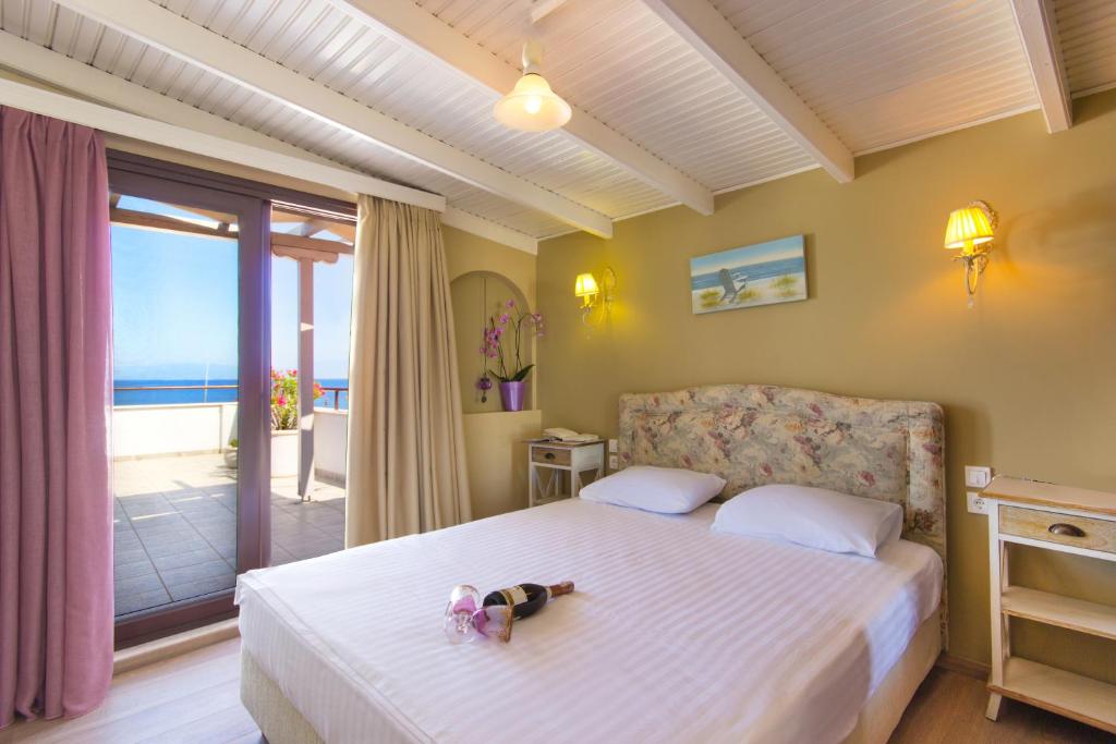 Postel nebo postele na pokoji v ubytování Hotel Galini