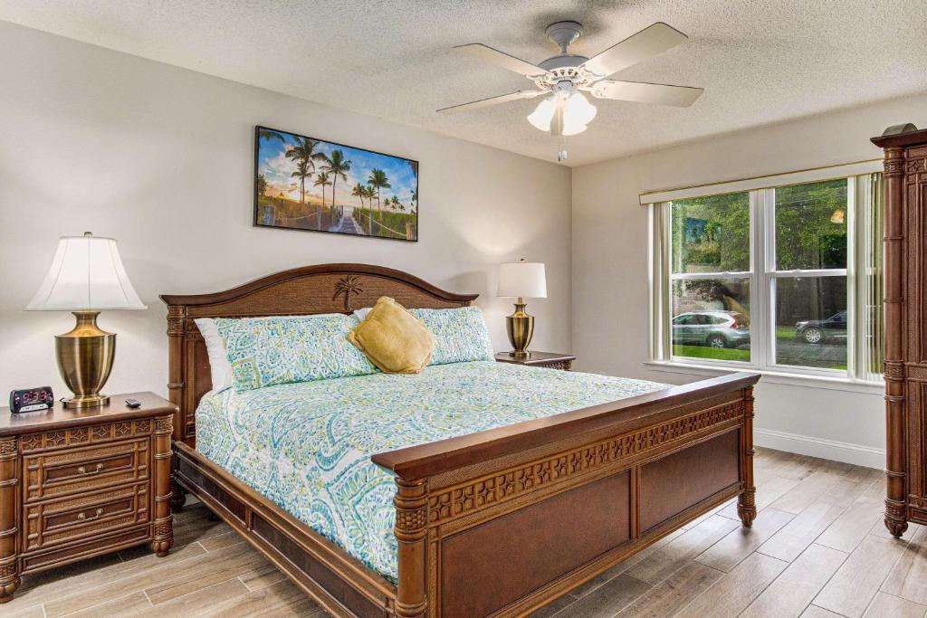 a bedroom with a bed and a ceiling fan at Goin' Coastal in Pensacola