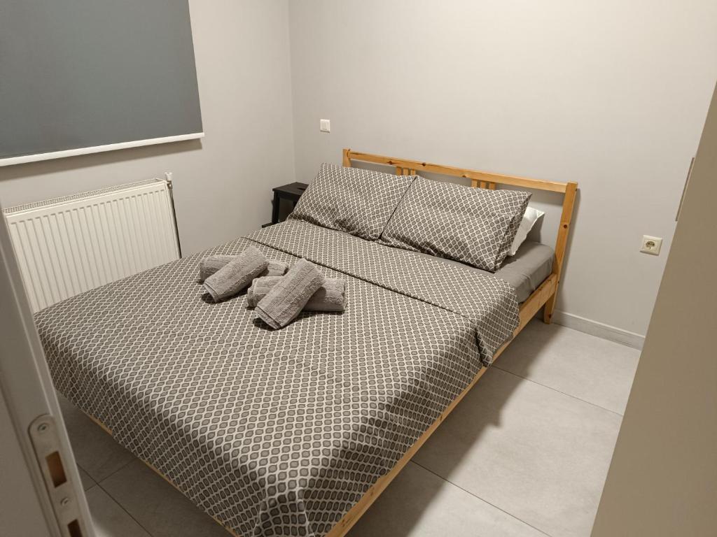 Ένα ή περισσότερα κρεβάτια σε δωμάτιο στο Central apartment's in Trikala 2