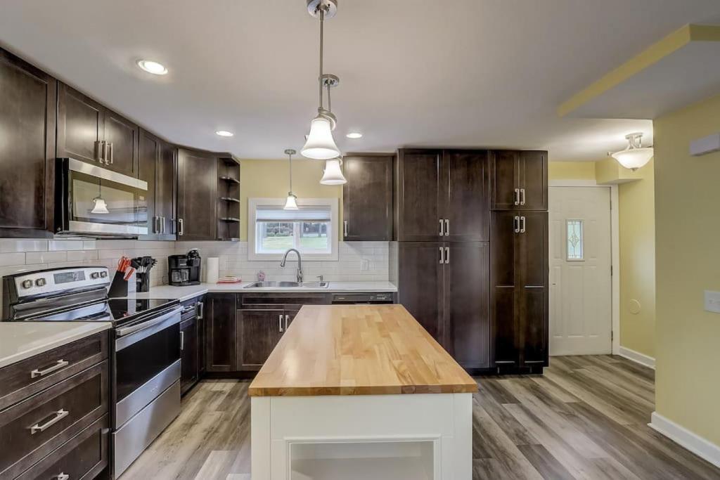 a kitchen with wooden cabinets and a wooden counter top at Destination Dells II at Tamarack Resort in Wisconsin Dells