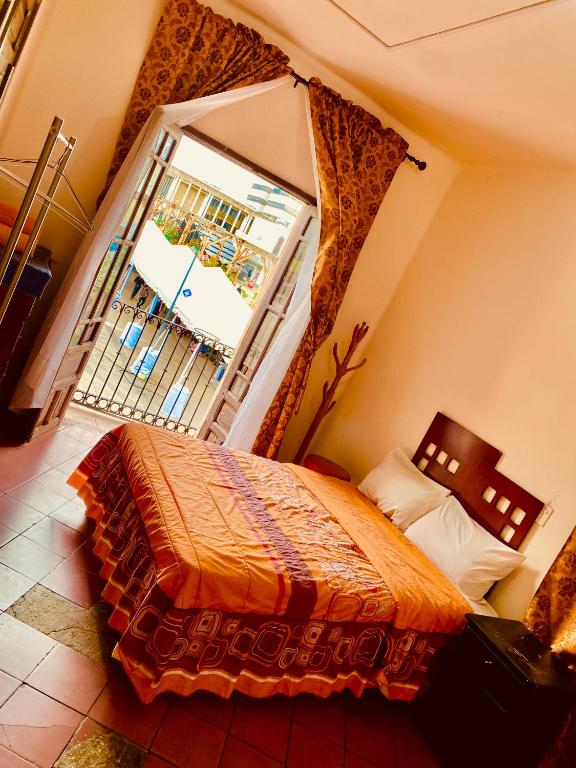 Postel nebo postele na pokoji v ubytování Hostal Santuario de las Libelulas