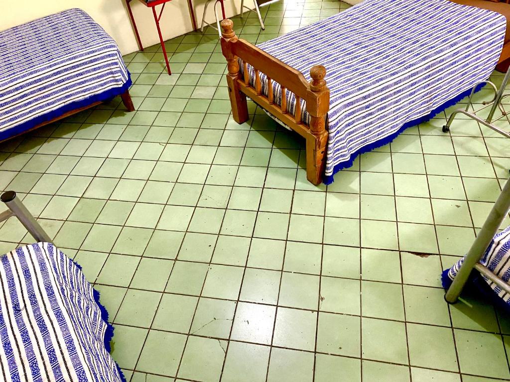 Postel nebo postele na pokoji v ubytování Hostal Santuario de las Libelulas