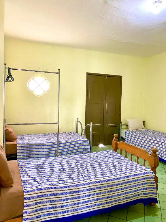 Postel nebo postele na pokoji v ubytování Hostal Santuario de las Libelulas