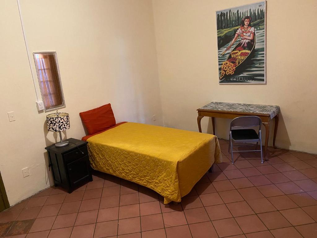 Postel nebo postele na pokoji v ubytování Hostal Santuario de las Libelulas