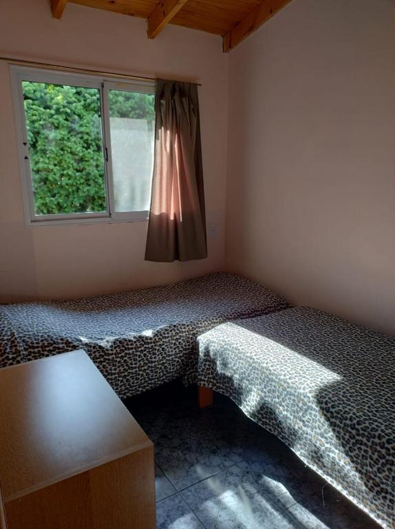 Voodi või voodid majutusasutuse Cabañas La Perla toas