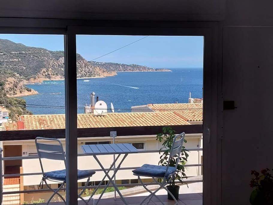 a view of the ocean from a balcony at Cala Salions Balandro II Tossa de mar in Cañet de Mar