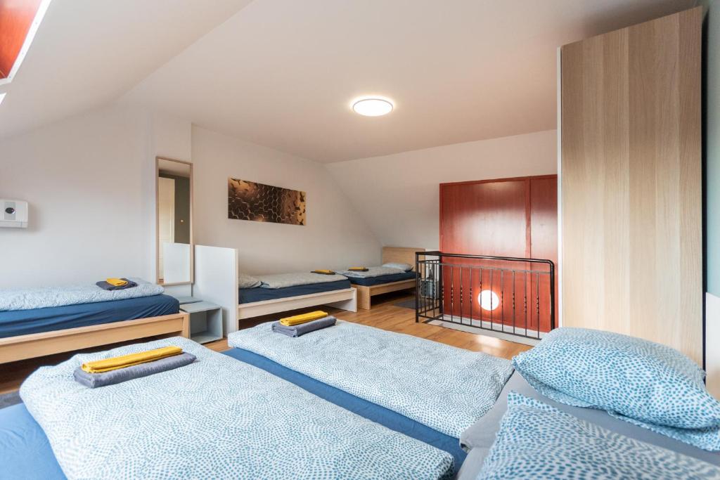 a bedroom with two beds and a fire place at R APARTMENTS BUDAPEST in Budapest