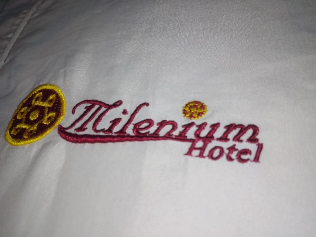 a hotel sign on top of a white towel at Hotel Mileniun Valledupar in Valledupar