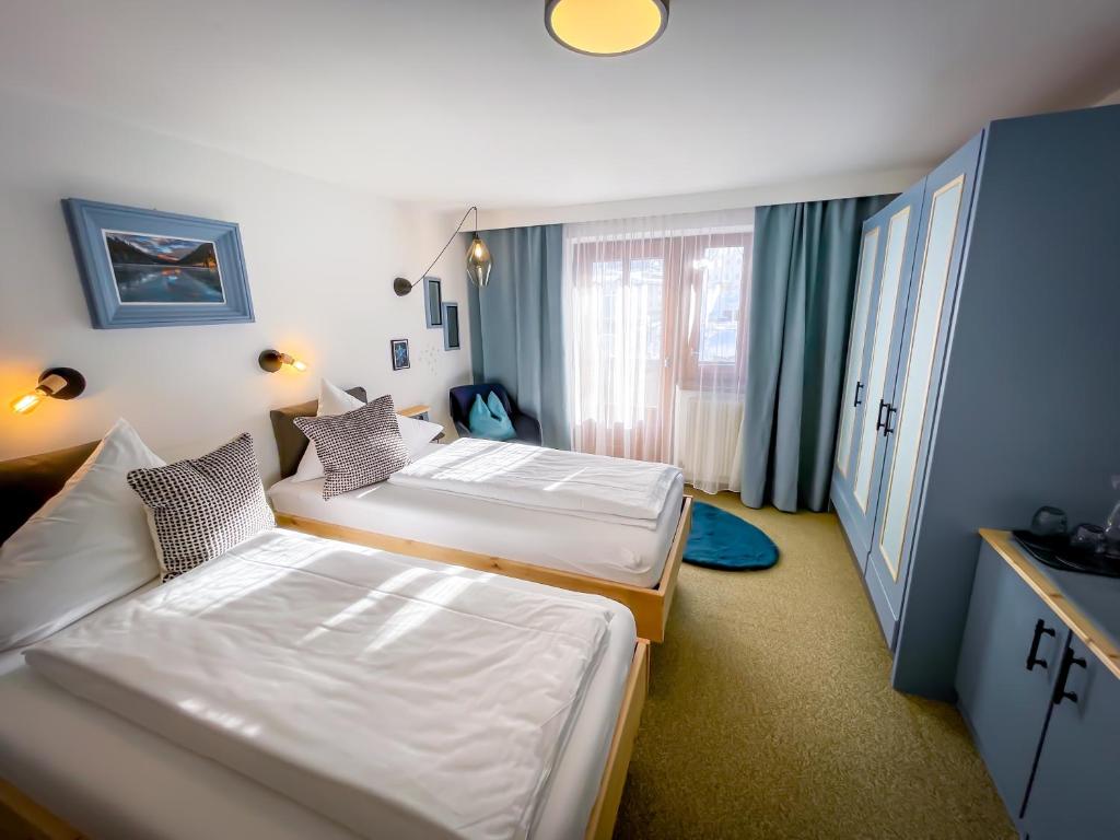 Postel nebo postele na pokoji v ubytování Hotel Tenne