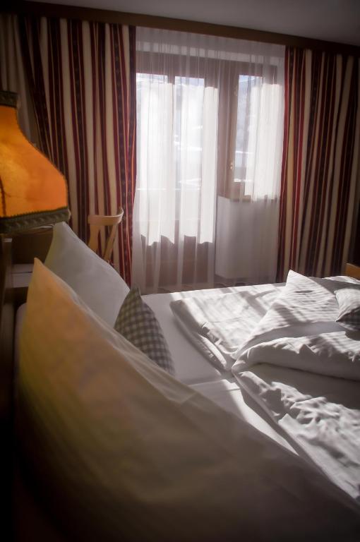 Postel nebo postele na pokoji v ubytování Hotel Tenne