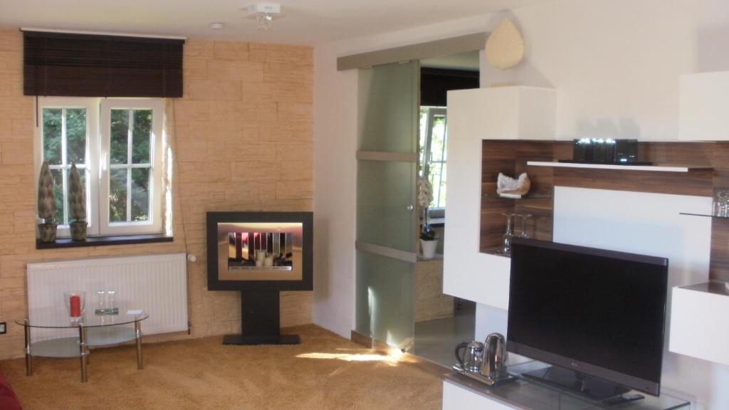 TV a/nebo společenská místnost v ubytování Gästezimmer Im Haus Am Wald