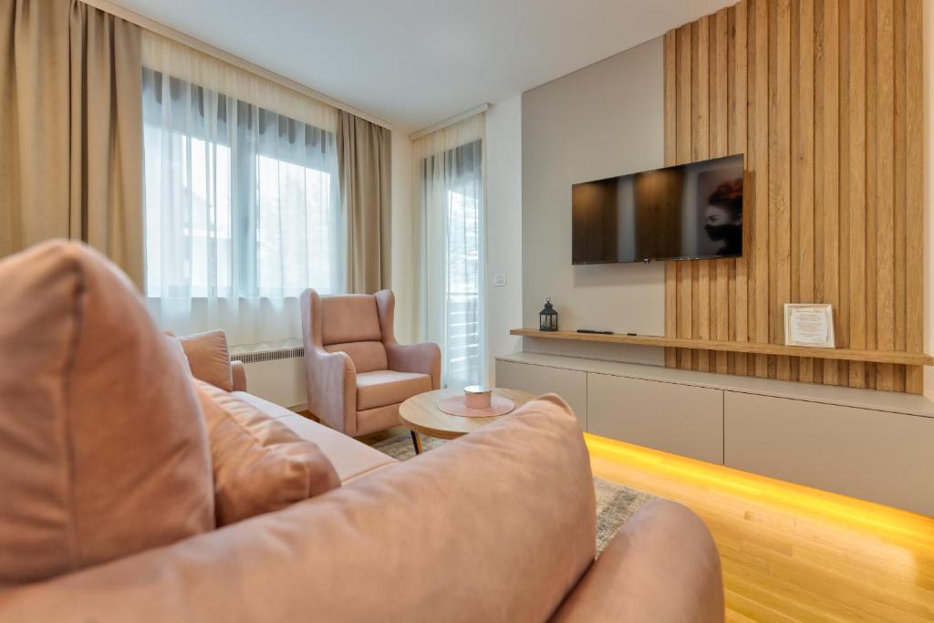 TV a/nebo společenská místnost v ubytování Apartmani MIVA