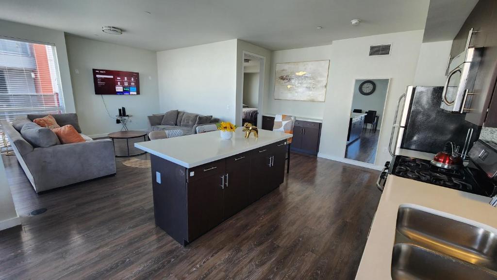 a kitchen and living room with an island in the middle at Amazing 2Bdr Home Must See DTLA in Los Angeles