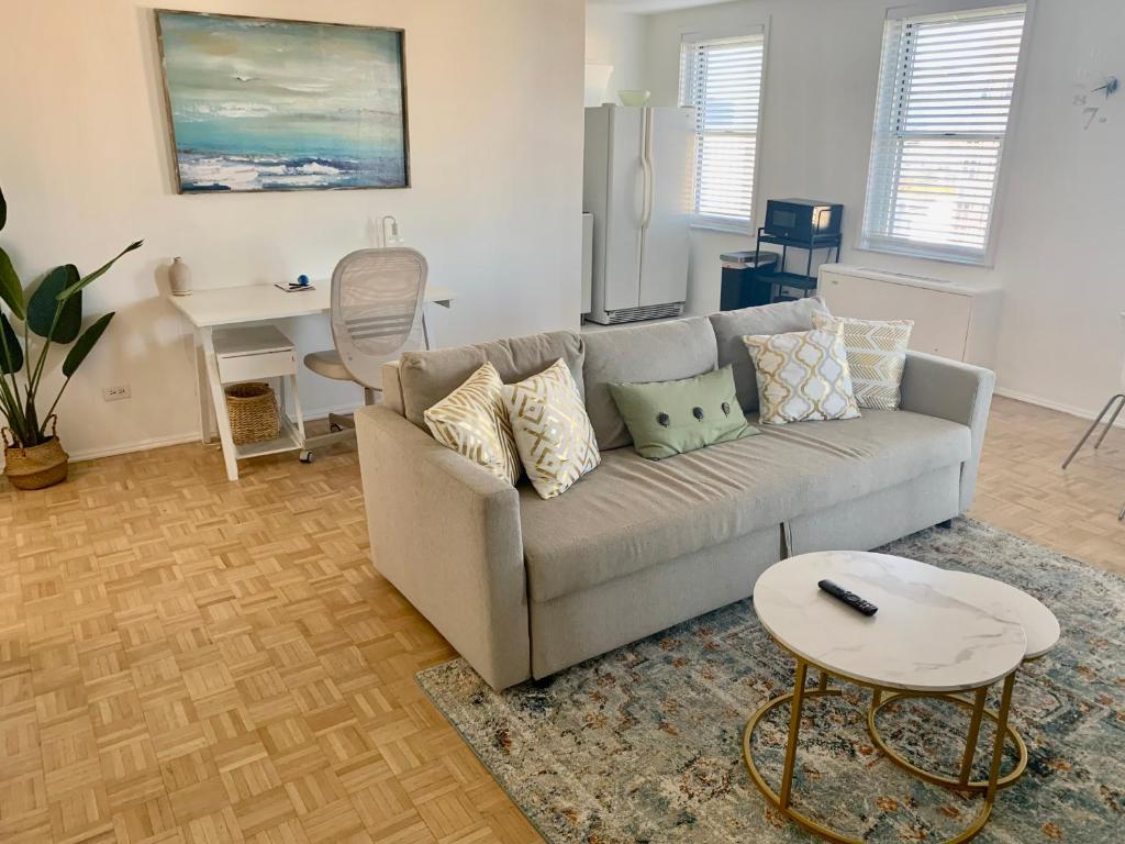 a living room with a couch and a table at New ATL Dwntwn Condo with Balcony 2 in Atlanta