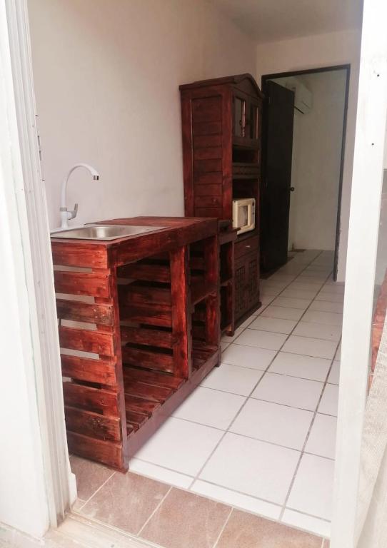 Kuchyň nebo kuchyňský kout v ubytování Confortable Suite con terrza
