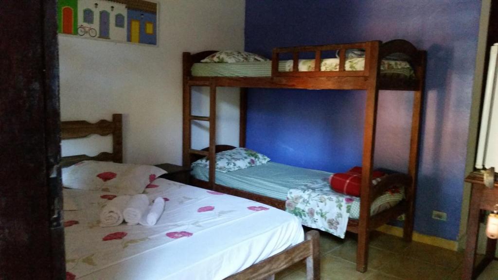 Postel nebo postele na pokoji v ubytování Pousada Água do Mar