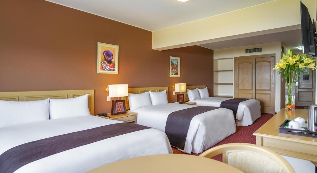 Postel nebo postele na pokoji v ubytování Hotel Jose Antonio Puno