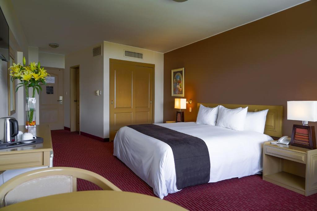 Postel nebo postele na pokoji v ubytování Hotel Jose Antonio Puno