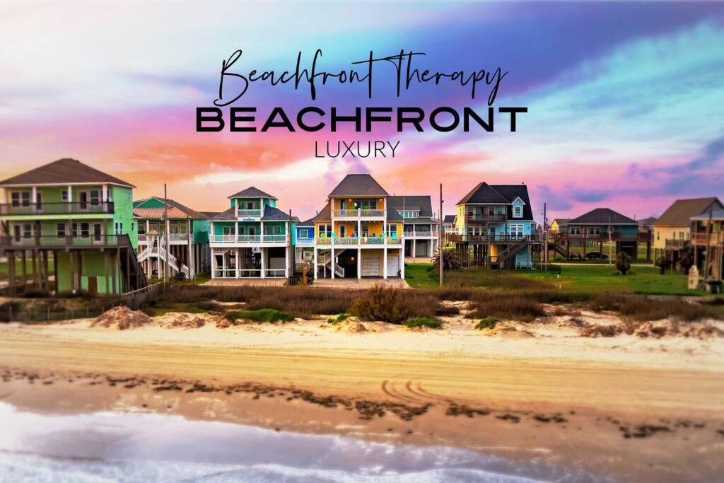una fila de casas en la playa con las palabras hermoso inventario lujo frente a la playa en Beachfront*Spectacular View*4 BD*sleeps 14, en Bolivar Peninsula