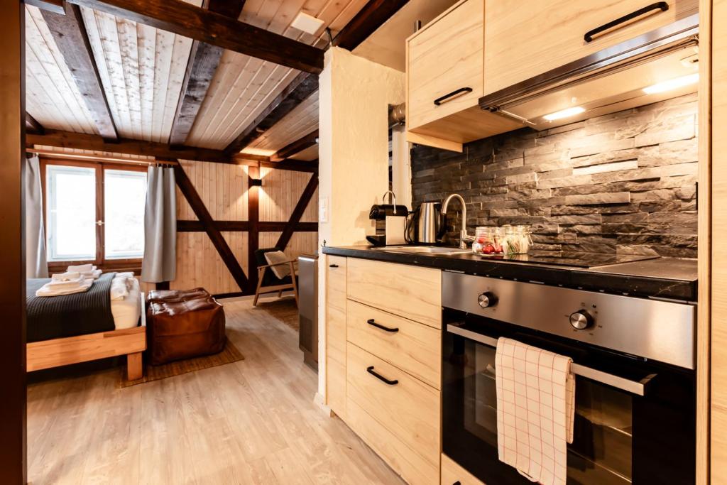 Kuchyň nebo kuchyňský kout v ubytování INN JOY Apartments - Flumserberg mit Bergpanorama