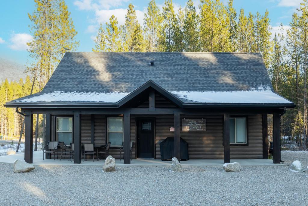 a small log cabin with a roof at The Alpine Cabin in Valemount