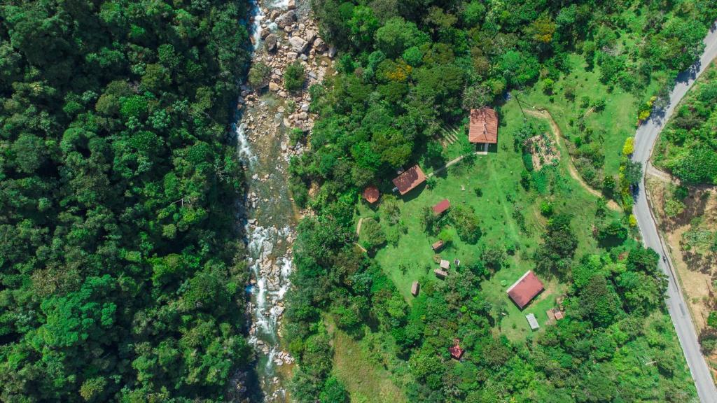 an aerial view of a house in a forest at La Perla Negra - Black Pearl Eco Hostel in San Rafael