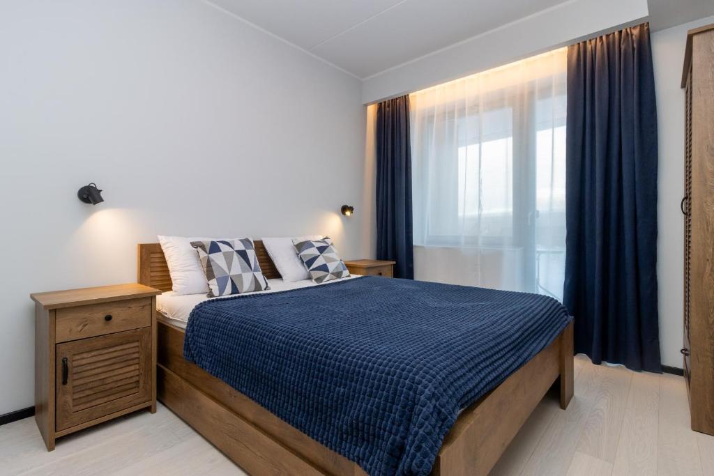 Ένα ή περισσότερα κρεβάτια σε δωμάτιο στο Cozy apartment by the Baltic Sea