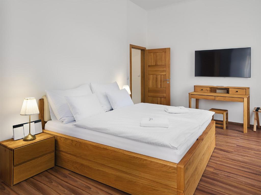 Postel nebo postele na pokoji v ubytování IMPERIAL Apartments
